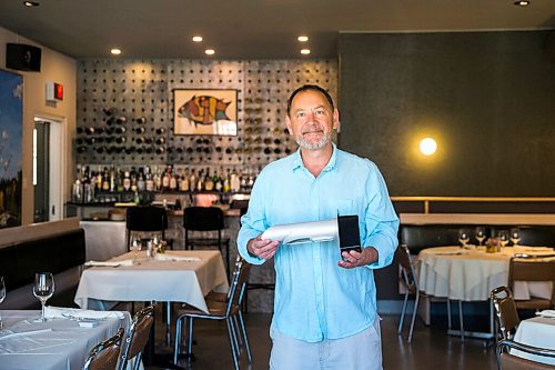 MIKAELA MACKENZIE / WINNIPEG FREE PRESS

Scot McTaggart, owner of Fusion Grill, shows off the air filtering device (which will be installed into his ventilation system) in his restaurant in Winnipeg on Friday, June 19, 2020.  Studies are going on to see if the system will kill COVID-19. For Gabrielle Piche story.
Winnipeg Free Press 2020.