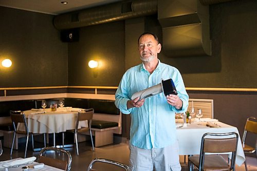 MIKAELA MACKENZIE / WINNIPEG FREE PRESS

Scot McTaggart, owner of Fusion Grill, shows off the air filtering device (which will be installed into his ventilation system) in his restaurant in Winnipeg on Friday, June 19, 2020.  Studies are going on to see if the system will kill COVID-19. For Gabrielle Piche story.
Winnipeg Free Press 2020.