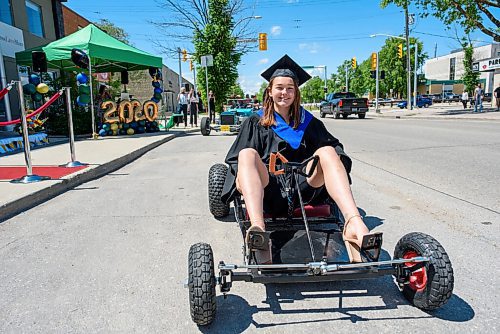 JESSE BOILY  / WINNIPEG FREE PRESS
Gianna Donnelly, built her go-kart as a school project and hopes to go into the welding program at Red River College, drives up to the podium at the Seven Oaks Met schools graduation on Friday. The school put together a special drive thru for it 27 graduates. Families drove up in  two cars to celebrate their graduates. Graduates then walked up on stage in front of their families and moved their own tassels for social distancing purposes.  Friday, June 19, 2020.
Reporter: