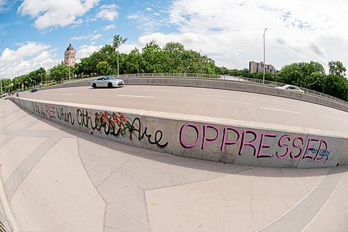 Mike Sudoma / Winnipeg Free Press
A graffiti tag reading No One is Free When Others Are Oppressed on the side of the pedestrian walkways on the Osborne Bridge Saturday morning. 
June 20, 2020