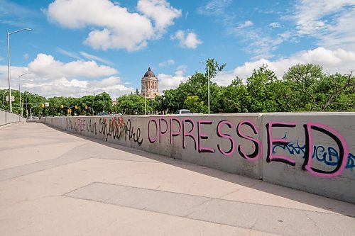 Mike Sudoma / Winnipeg Free Press
A graffiti tag reading No One is Free When Others Are Oppressed on the side of the pedestrian walkways on the Osborne Bridge Saturday morning. 
June 20, 2020