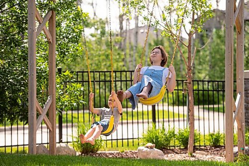 Mike Sudoma / Winnipeg Free Press
Choir singers Mabel and Henry Harrington take some time to swing on the swings as their schedules have a lot more free time these days as singing in their choirs is still on hold because of CoVid 19.
June 20, 2020