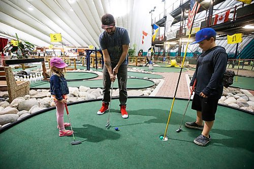 JOHN WOODS / WINNIPEG FREE PRESS
Marcus Gooch took advantage of COVID-19 phase 3 opening and plays mini-golf with his daughter Olivia, 3, and his nephew Quinn, 7, at The Golf Dome on Fathers Day Sunday, June 21, 2020. 

Reporter: standup