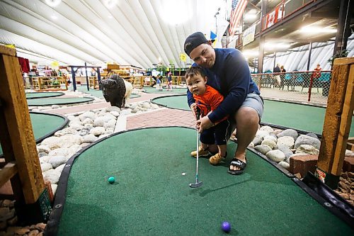 JOHN WOODS / WINNIPEG FREE PRESS
Cody Larson took advantage of COVID-19 phase 3 opening and plays mini-golf with his son Parker, 2, at The Golf Dome on Fathers Day Sunday, June 21, 2020. 

Reporter: standup