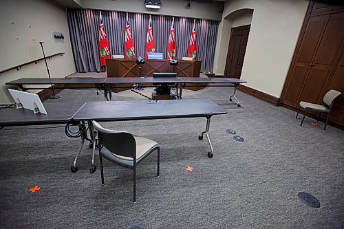 MIKE DEAL / WINNIPEG FREE PRESS
The empty press conference room at the Manitoba Legislative building just prior to the latest COVID-19 update Monday afternoon. The room is partially reconfigured for a resumption of "normal" press briefings that reporters will attend in person. Orange tape on the floor would represent where a reporter would be allowed to sit. 
200622 - Monday, June 22, 2020.