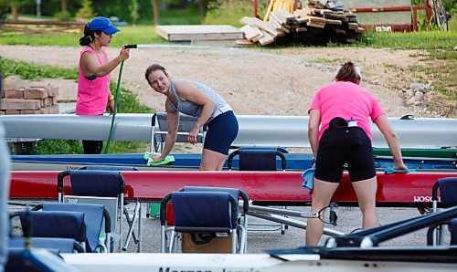 MIKE DEAL / WINNIPEG FREE PRESS
Courtney Reich of the Winnipeg Rowing Club chats with fellow rowers as she cleans her boat prior to heading out onto the river. 
See Pandemic feature by Mike Sawatzky.
200623 - Tuesday, June 23, 2020.