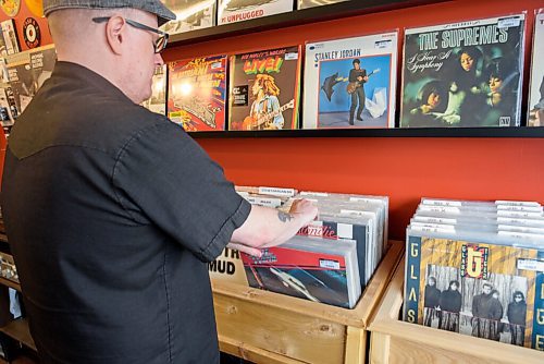 JESSE BOILY  / WINNIPEG FREE PRESS
Steve Ward, the owner of Hi Tone Records, looks through the records in his downtown Selkirk store on Tuesday. Steve shares the space with his wife Angela Ward who runs a barber shop at the back of the store.  Tuesday, June 23, 2020.
Reporter: Dave Sanderson