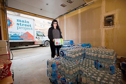 MIKE DEAL / WINNIPEG FREE PRESS
Cindy Titus with the Main Street Project with some of the water that has already been donated. Main Street Project is holding a water drive this week with a goal of collecting 20,000 bottles of donated water.
200623 - Tuesday, June 23, 2020.