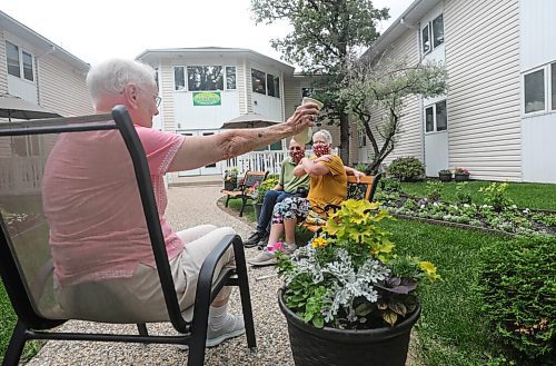 RUTH BONNEVILLE / WINNIPEG FREE PRESS

LOCAL - care homes

Joyce Church, a resident of Thorvaldson Care Centre, reaches out to give her daughter, Janis Brackman and her son-in-law Alan Brackman, a distance hug in the outdoor patio space at her residence on Tuesday.  

What: Family members can now visit their loved ones in personal care homes (COVID-19 restrictions are changing).

See Gabby's story. 

.June 23,  2020