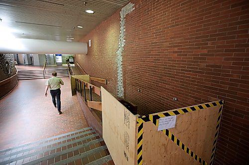 JOHN WOODS / WINNIPEG FREE PRESS
A person walks past a closed off wheelchair ramp in the Portage and Main concourse in Winnipeg Tuesday, June 23, 2020. A city report requires the concourse to undergo major repairs.

Reporter: da silva