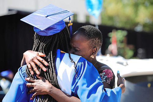 RUTH BONNEVILLE / WINNIPEG FREE PRESS

LOCAL - Drive-In Graduation at St. Maurice High School, 1639 Pembina Highway.

Photo of Valedictorian, Miss Nyume Mahmoud getting a hug from her mother, Elizabeth Mahmoud during ceremony Wednesday.  

Graduating students at  St. Maurice High School attend an outdoor graduation ceremony in their school parking lot with their fellow students with social distancing measures in place on Wednesday.  Students sat in seats set apart while their families stayed in their vehicles behind them.  

See Gabby's story. 

.June 24,  2020