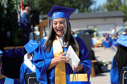 RUTH BONNEVILLE / WINNIPEG FREE PRESS

LOCAL - Drive-In Graduation at St. Maurice High School, 1639 Pembina Highway.

Photo of Victoria Romero as she celebrates with her fellow classmates her grad on Wednesday.  

Graduating students at  St. Maurice High School attend an outdoor graduation ceremony in their school parking lot with their fellow students with social distancing measures in place on Wednesday.  Students sat in seats set apart while their families stayed in their vehicles behind them.  

See Gabby's story. 

.June 24,  2020