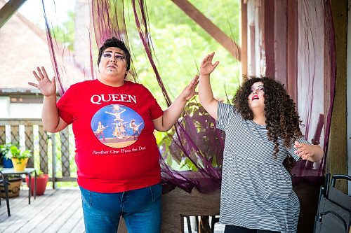 MIKAELA MACKENZIE / WINNIPEG FREE PRESS

Guncle Smokey Trixx Starr (left) and Olivia Limeheart pose for portraits on their porch in Winnipeg on Thursday, June 25, 2020. The two are stars of Synonym Art Consultation's drag safe grad video. For Eva Wasney story. 
Winnipeg Free Press 2020.