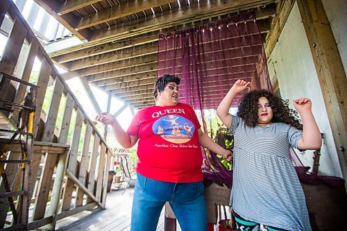 MIKAELA MACKENZIE / WINNIPEG FREE PRESS

Guncle Smokey Trixx Starr (left) and Olivia Limeheart pose for portraits on their porch in Winnipeg on Thursday, June 25, 2020. The two are stars of Synonym Art Consultation's drag safe grad video. For Eva Wasney story. 
Winnipeg Free Press 2020.