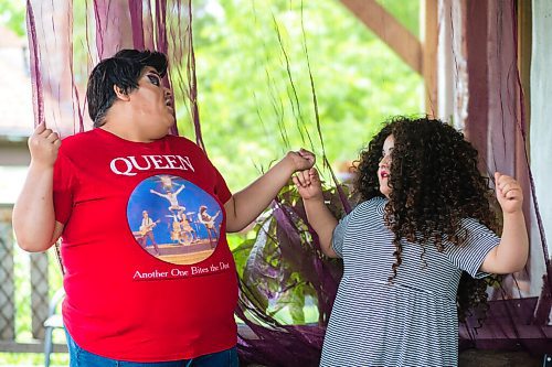 MIKAELA MACKENZIE / WINNIPEG FREE PRESS

Guncle Smokey Trixx Starr (left) and Olivia Limeheart pose for portraits on their porch in Winnipeg on Thursday, June 25, 2020. The two are stars of Synonym Art Consultation's drag safe grad video. For Eva Wasney story. 
Winnipeg Free Press 2020.