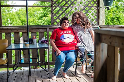 MIKAELA MACKENZIE / WINNIPEG FREE PRESS

Guncle Smokey Trixx Starr (left) and Olivia Limeheart pose for portraits on their porch in Winnipeg on Thursday, June 25, 2020. The two are stars of Synonym Art Consultation's drag safe grad video. For Eva Wasney story. 
Winnipeg Free Press 2020.