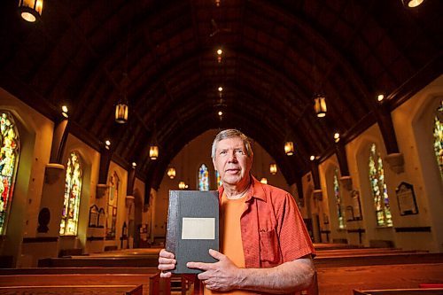 MIKE DEAL / WINNIPEG FREE PRESS
Terry Moore with a record book dating from 1860-1903 at St. John's Anglican Cathedral, 135 Anderson Ave.
St. John's Cathedral was poised to celebrated 200 years in 2020, but all big celebrations are cancelled. Instead, parishioner Terry Moore has researched and written more than 100 little stories about the church's history in establishing the Anglican church in Western Canada.
200625 - Thursday, June 25, 2020.