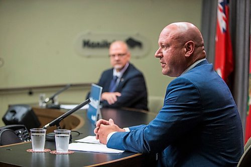 MIKAELA MACKENZIE / WINNIPEG FREE PRESS

Chief provincial public health officer Brent Roussin (front) and education minister Kelvin Goertzen speak to the media at the Manitoba Legislative Building in Winnipeg on Thursday, June 25, 2020. For Maggie story. 
Winnipeg Free Press 2020.