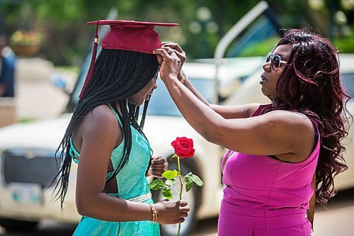 MIKAELA MACKENZIE / WINNIPEG FREE PRESS

Daniel McIntyre Collegiate Institute grad Jayden Cameron gets her cap adjusted by her mom, Cindy Cameron, before getting professional photos taken with a limo for free at the Manitoba Legislative Building in Winnipeg on Thursday, June 25, 2020. 
Winnipeg Free Press 2020.