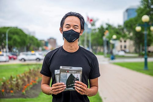 MIKAELA MACKENZIE / WINNIPEG FREE PRESS

Stephen Hua poses for a portrait with his Together Masks at the Manitoba Legislative Building in Winnipeg on Thursday, June 25, 2020. Hua started the mask business, along with a couple of other ones, when the hospitality and entertainment industry came to an abrupt halt with the pandemic. For Martin Cash story.
Winnipeg Free Press 2020.