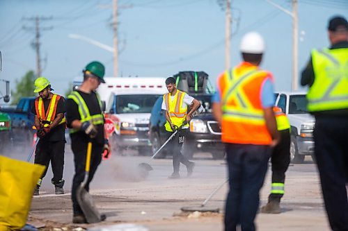 MIKAELA MACKENZIE / WINNIPEG FREE PRESS

Crews clean up a semi crash, where French fries spilled across the road, eastbound on Portage Avenue at Race Track Road in Winnipeg on Friday, June 26, 2020. 
Winnipeg Free Press 2020.
