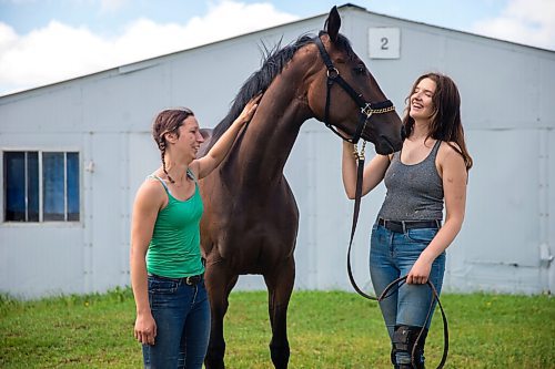 MIKAELA MACKENZIE / WINNIPEG FREE PRESS

Trainer Tiffany Husbands (left) and groom Paige Berard pose with stakes winner Dazzling Gold at the Assiniboia Downs backstretch in Winnipeg on Friday, June 26, 2020. For George Williams story.
Winnipeg Free Press 2020.