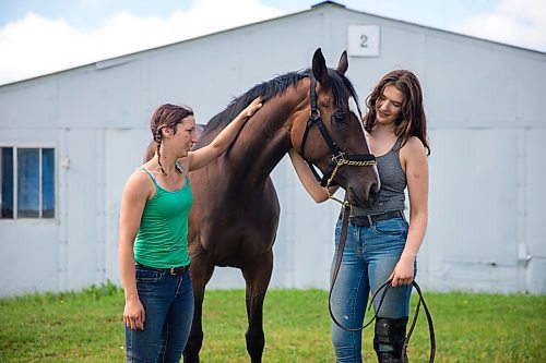 MIKAELA MACKENZIE / WINNIPEG FREE PRESS

Trainer Tiffany Husbands (left) and groom Paige Berard pose with stakes winner Dazzling Gold at the Assiniboia Downs backstretch in Winnipeg on Friday, June 26, 2020. For George Williams story.
Winnipeg Free Press 2020.