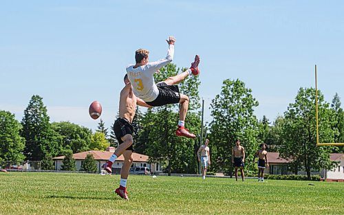 Mike Sudoma / Winnipeg Free Press
Oak Park Wide Receiver, Damien Jacobs, takes down fellow wide receiver, Justice Flett as they practice alongside a few other members of the Oak Park Raiders at Charleswood Broncos Club Field Friday afternoon
June 26, 2020