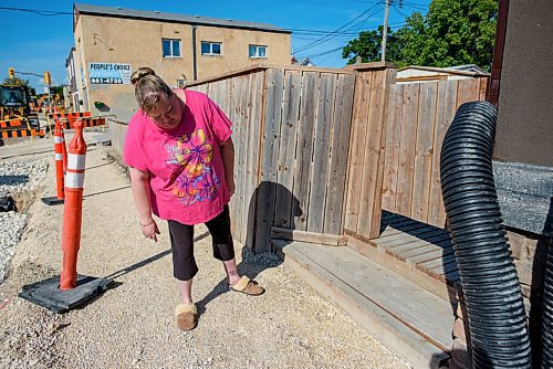 JESSE BOILY  / WINNIPEG FREE PRESS
Leslie Carey shows some of the damage done to her home from the construction on the road next to her home on Friday. The bad smelling water has caused her to need to get bottled water to drink and clean with, as she cant do dishes, laundery or shower with the current tap water.  Friday, June 26, 2020.
Reporter: Gabby