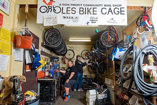 JESSE BOILY  / WINNIPEG FREE PRESS
Aaron Maciejko, left, and Charles Pearce, who are volunteers at Orioles Bike Cage, a community bicycle shop that helps people repair and maintain their bicycles, work bicycles on Friday. Friday, June 26, 2020.
Reporter: Aaron Epp