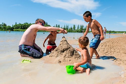 Daniel Crump / Winnipeg Free Press. Alexander Fullerton builds a sand castle on the beach with his three kids James, Nathanael and Aaron.Temperatures in the low 30s brought many people to the beach at Birds Hill Park. June 27, 2020.