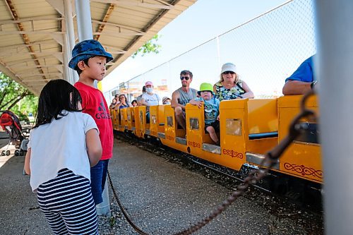 Daniel Crump / Winnipeg Free Press. Ethan Wang and his sister Elaine Wang wait to board the train at Tinkertown. As a safety precaution to prevent the spread of coronavirus all rides are cleaned after every use. June 27, 2020.