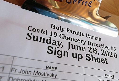 JOHN WOODS / WINNIPEG FREE PRESS
People sign-in before they enter for Sunday mass at Holy Family Church in Winnipeg Sunday, June 28, 2020. Religious institutions were allowed to open up their COVID-19 restrictions to include 50 people at their religious services.

Reporter: Kevin Rollason