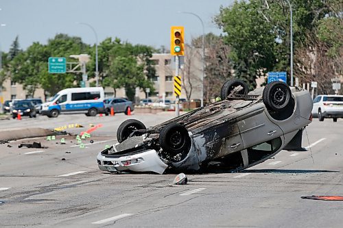JOHN WOODS / WINNIPEG FREE PRESS
Police investigate a rollover on Portage at Cavalier in Winnipeg Sunday, June 28, 2020. Collission was a result of a RCMP high speed chase.

Reporter: Kevin Rollason