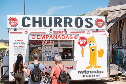 Mike Sudoma / Winnipeg Free Press
Customers wait for their orders at the Churro Stop food truck at the St Norbert Farmers Market Saturday morning
June 27, 2020