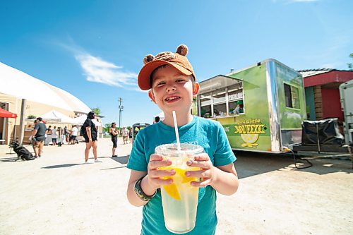 Mike Sudoma / Winnipeg Free Press
Doug Carlson cools off with a freshly squeezed lemonade from the Just a Little Squeeze lemonade truck as he and his family spend Saturday morning at the St Norbert Farmers Market 
June 27, 2020