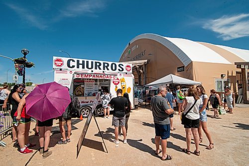 Mike Sudoma / Winnipeg Free Press
Customers wait for their orders at the Churro Stop food truck at the St Norbert Farmers Market Saturday morning
June 27, 2020