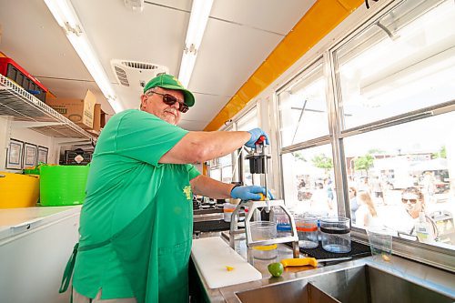 Mike Sudoma / Winnipeg Free Press
Randy Rowe squeezes up some lemonade for customers inside the Just a Little Squeeze truck at the St Norbert Farmers Market Saturday morning.
June 27, 2020