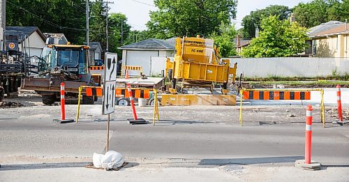 MIKE DEAL / WINNIPEG FREE PRESS
New street being paved on Corydon Avenue by a massive machine that automatically makes the curbs and the road during one pour of concrete. The result is that the curb needs to be removed at intersections. It makes for an odd view during construction.
200629 - Monday, June 29, 2020.