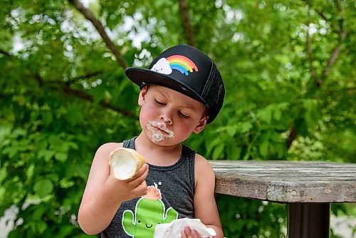 JESSE BOILY  / WINNIPEG FREE PRESS
Leo Petropolis, 3, cools off with some ice cream at Assiniboine park on Monday. Temperatures exceeded 30 degC on Monday. Monday, June 29, 2020.
Reporter: STDUP