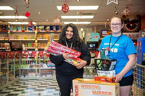MIKAELA MACKENZIE / WINNIPEG FREE PRESS

Emma Fernando (left) and Amber Proutt show off some of the store's top picks at Red Bomb Fireworks in Winnipeg on Monday, June 29, 2020. For Kevin story.
Winnipeg Free Press 2020.
