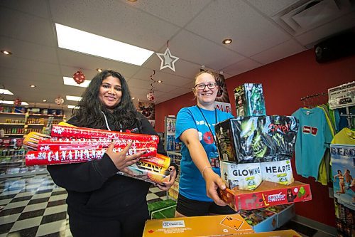 MIKAELA MACKENZIE / WINNIPEG FREE PRESS

Emma Fernando (left) and Amber Proutt show off some of the store's top picks at Red Bomb Fireworks in Winnipeg on Monday, June 29, 2020. For Kevin story.
Winnipeg Free Press 2020.