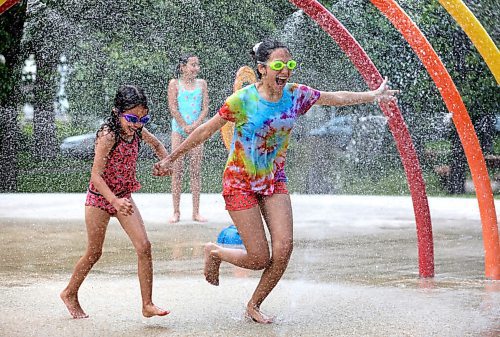 RUTH BONNEVILLE / WINNIPEG FREE PRESS
 
Local - Weather Standup Splash Pad

Sisters Maylis (12yrs) and Melanie (7yrs left), enjoy cooling themselves at Provencher Park Spray Pad during a heat wave in Winnipeg and surrounding areas on Monday. 




.June 29,  2020