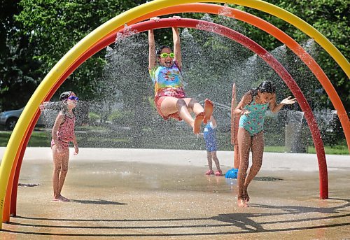 RUTH BONNEVILLE / WINNIPEG FREE PRESS
 
Local - Weather Standup Splash Pad

Sisters Maylis (12yrs) and Melanie (7yrs left), and Gabby Rémillard (8yrs,right) enjoy cooling themselves at Provencher Park Spray Pad during a heat wave in Winnipeg and surrounding areas on Monday. 
Note: I only have fist names for sisters. 



.June 29,  2020