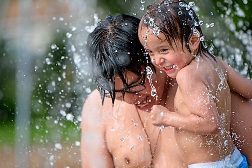 JESSE BOILY  / WINNIPEG FREE PRESS
Jason McDonald,3, and Dremond Bunn cool off at the Machray park spray pad on Monday. Monday, June 29, 2020.
Reporter: