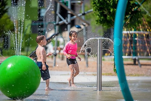 MIKAELA MACKENZIE / WINNIPEG FREE PRESS

Julia Thomas, four (centre), and Zander Henry, three, play at the splash pad at Sergeant Tommy Prince Place in Winnipeg on Tuesday, June 30, 2020. Standup.
Winnipeg Free Press 2020.