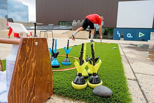 JESSE BOILY  / WINNIPEG FREE PRESS
A volunteer cleans up and disinfects a lawn dart at the newly opened rooftop at the Winnipeg Art Gallery on Wednesday. Wednesday, July 1, 2020.
Reporter: