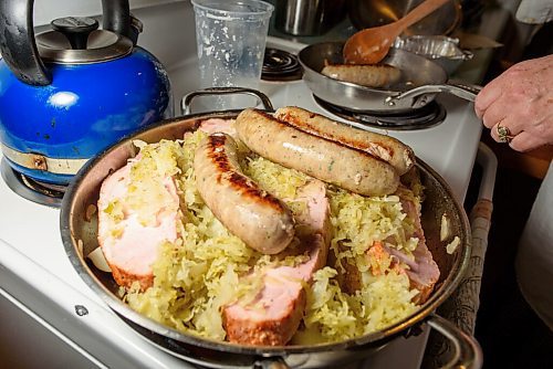 JESSE BOILY  / WINNIPEG FREE PRESS
Alison Gillmor adds sausages to her choucroute garni before baking it from a dinner kit by Little Goat on Thursday. Thursday, July 2, 2020.
Reporter: Alison Gillmor