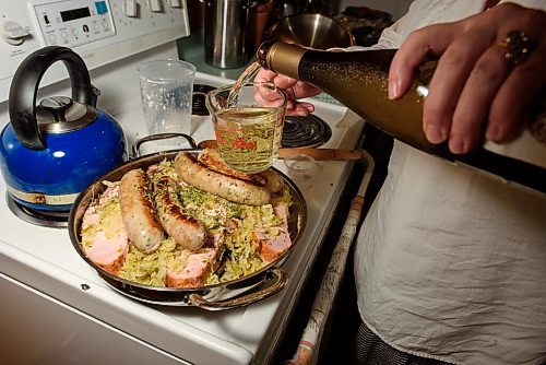 JESSE BOILY  / WINNIPEG FREE PRESS
Alison Gillmor adds some wine to her choucroute garni before baking it from a dinner kit by Little Goat on Thursday. Thursday, July 2, 2020.
Reporter: Alison Gillmor