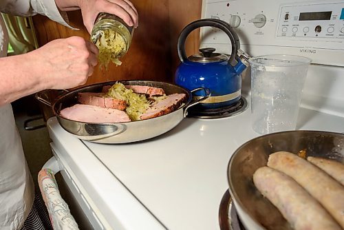 JESSE BOILY  / WINNIPEG FREE PRESS
Alison Gillmor adds sauerkraut as she cooks her choucroute garni dinner kit from Little Goat on Thursday. Thursday, July 2, 2020.
Reporter: Alison Gillmor